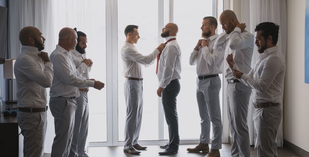 wedding photography of groomsmen getting ready for the wedding