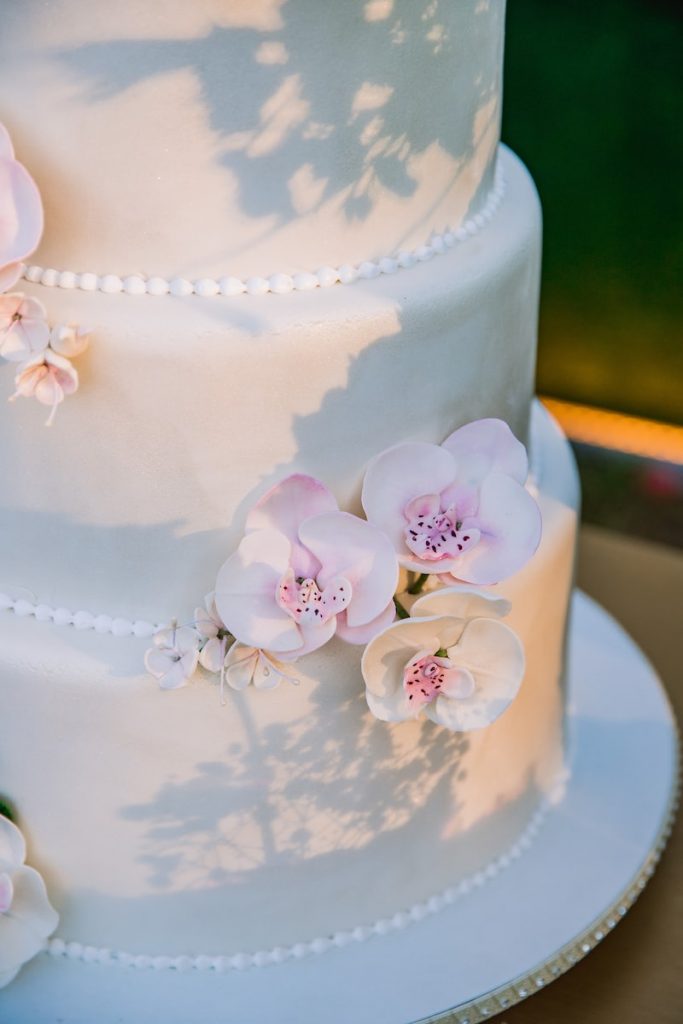 white and pink floral cake