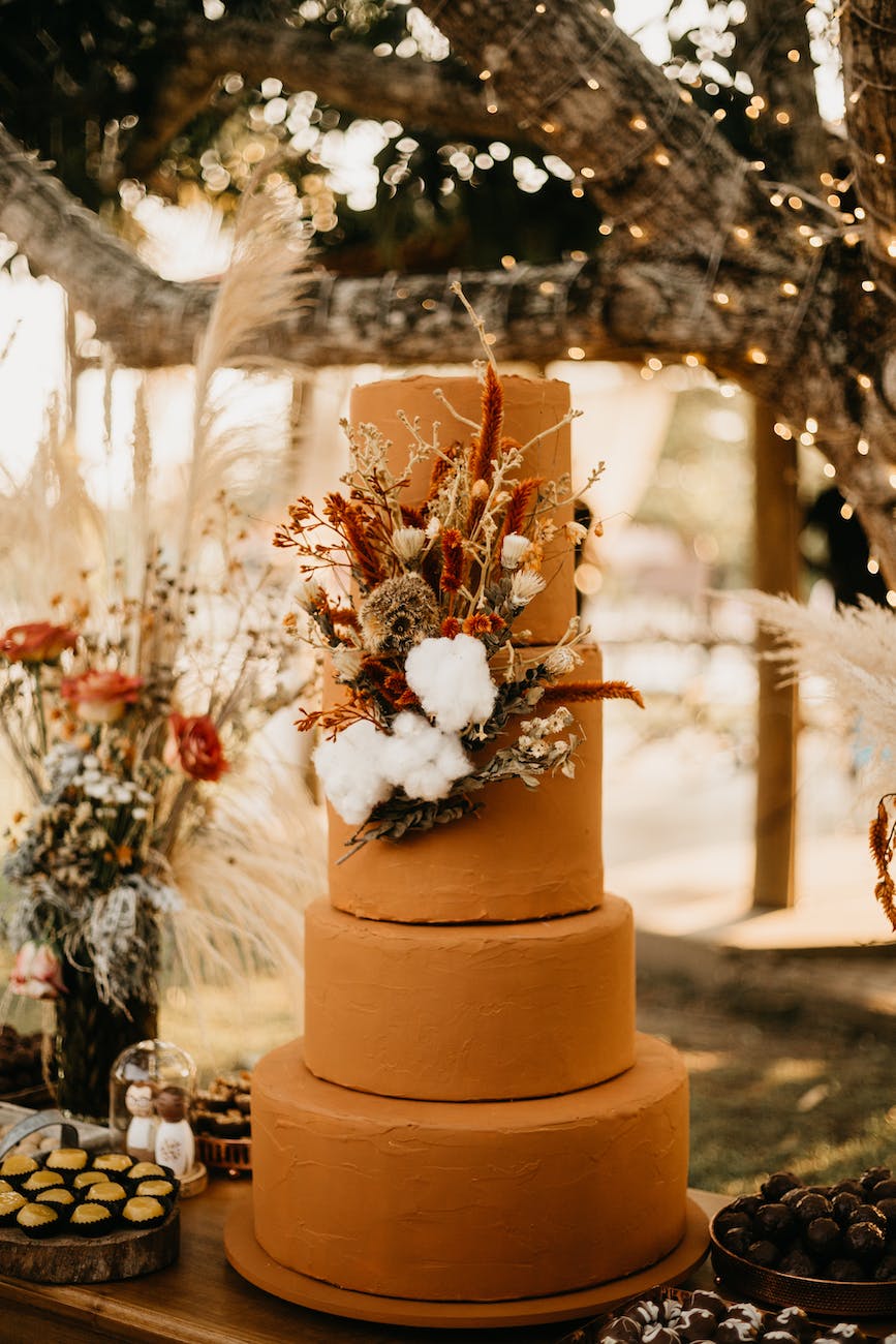 brown wedding cake with flowers