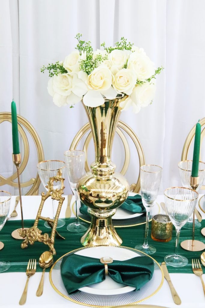 white roses in clear glass vase