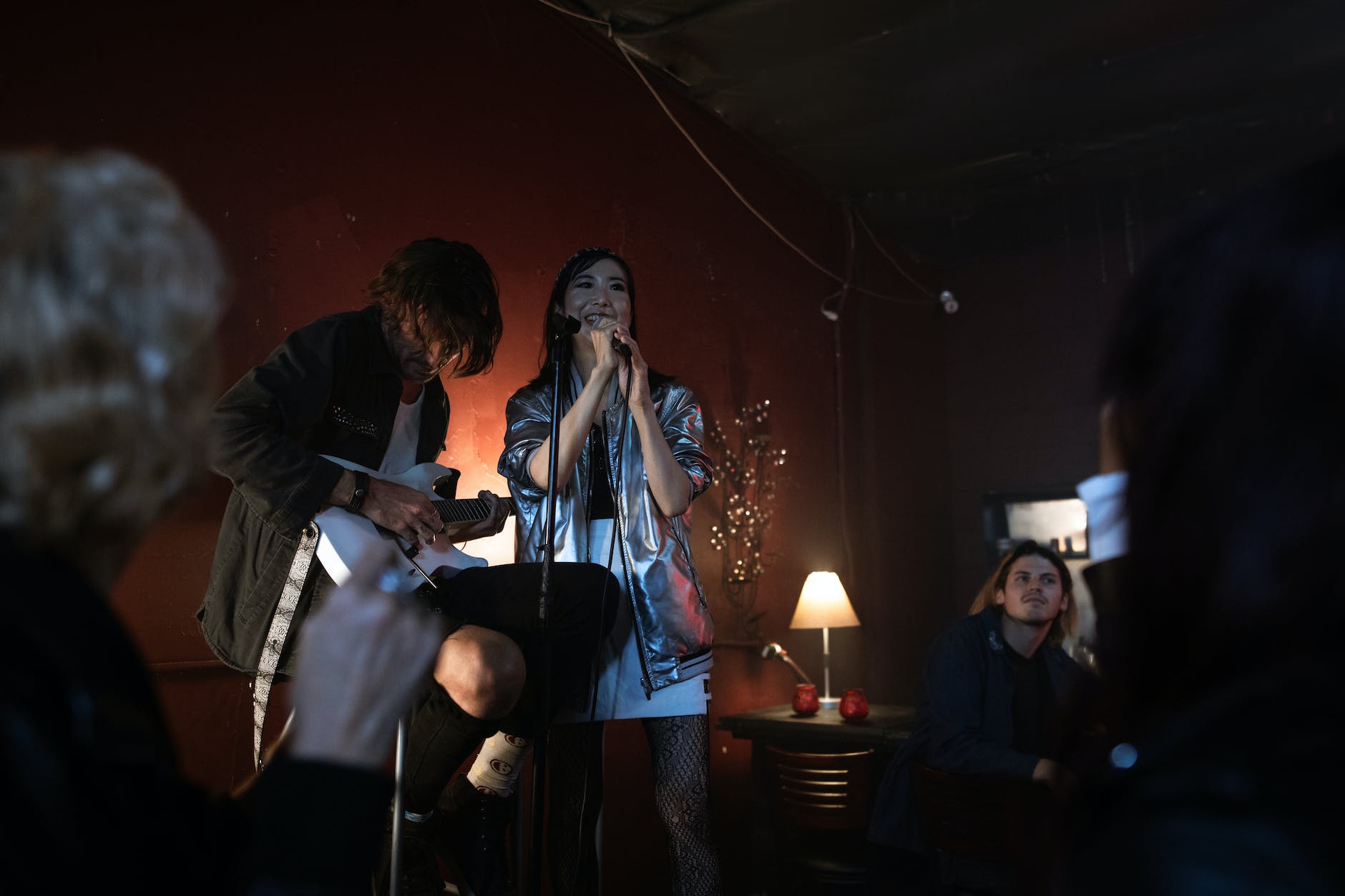 a woman singing on stage