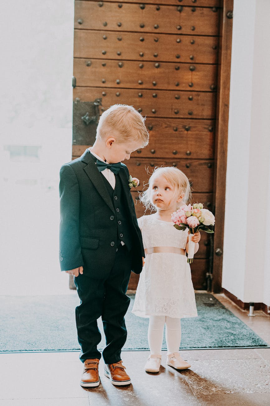 little bride and groom in bright hall